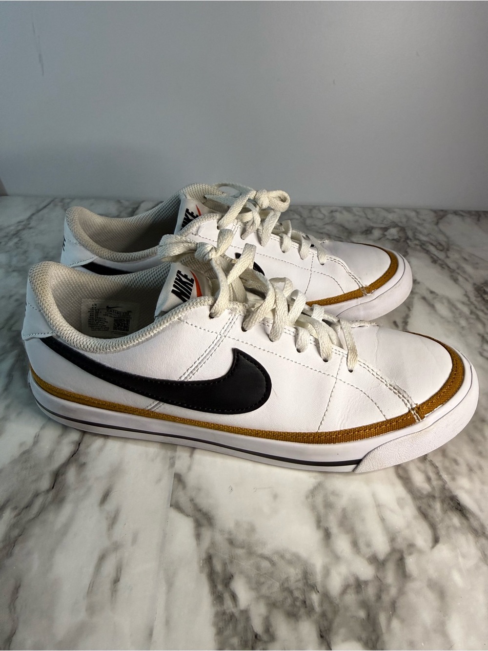 Nike kids White Leather Sneakers with Black Swoosh and Gold Accent